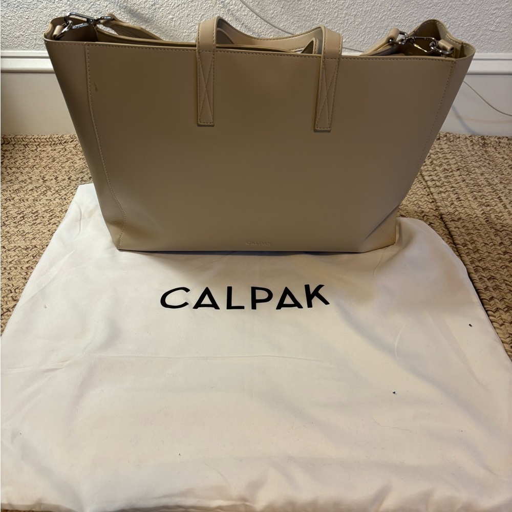 Calpak Cream Laptop Bag with Minimalist Design